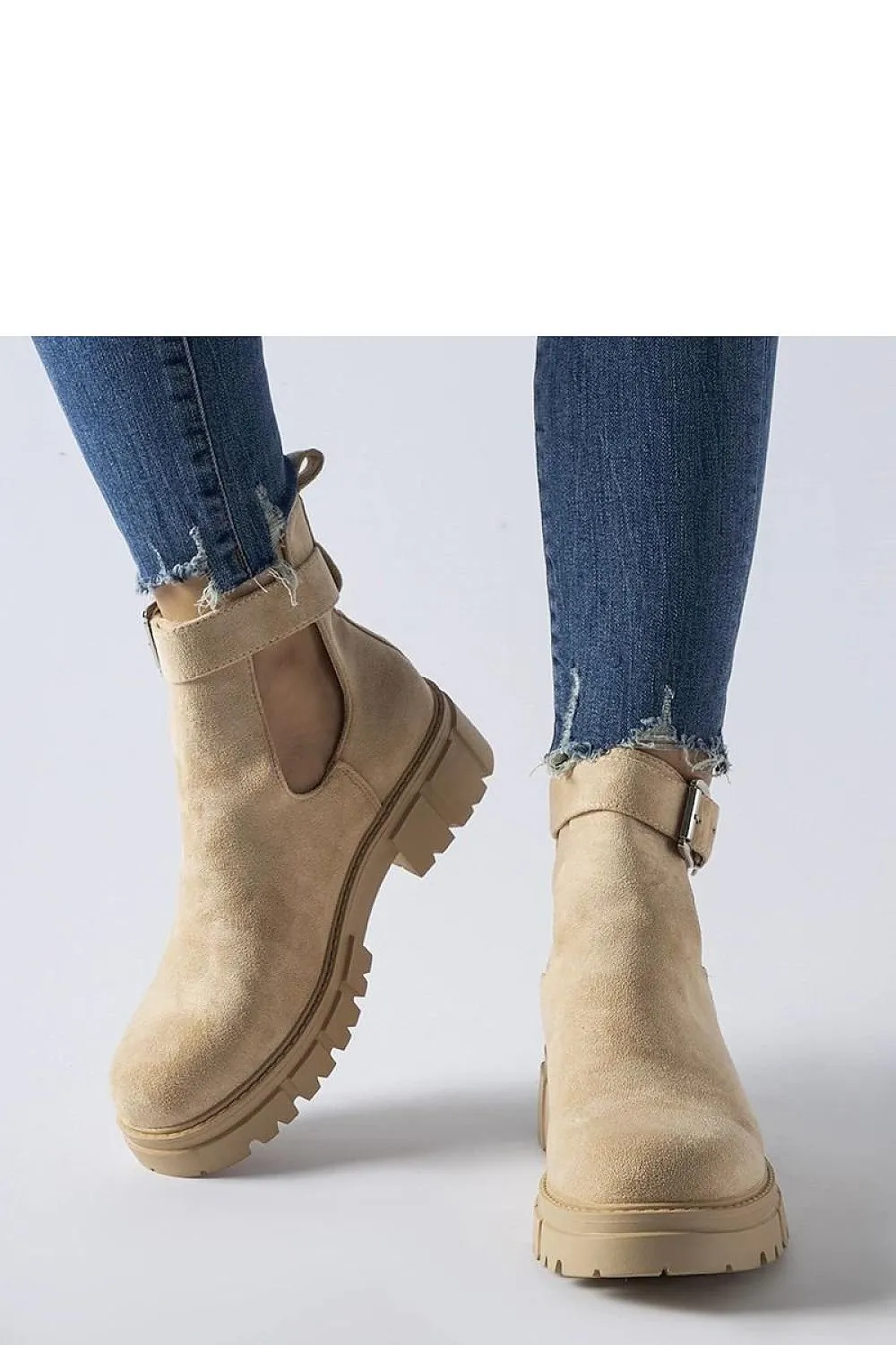 Beige ankle boots with decorative fastening