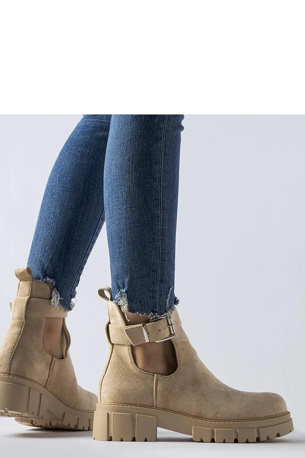 Beige ankle boots with decorative fastening