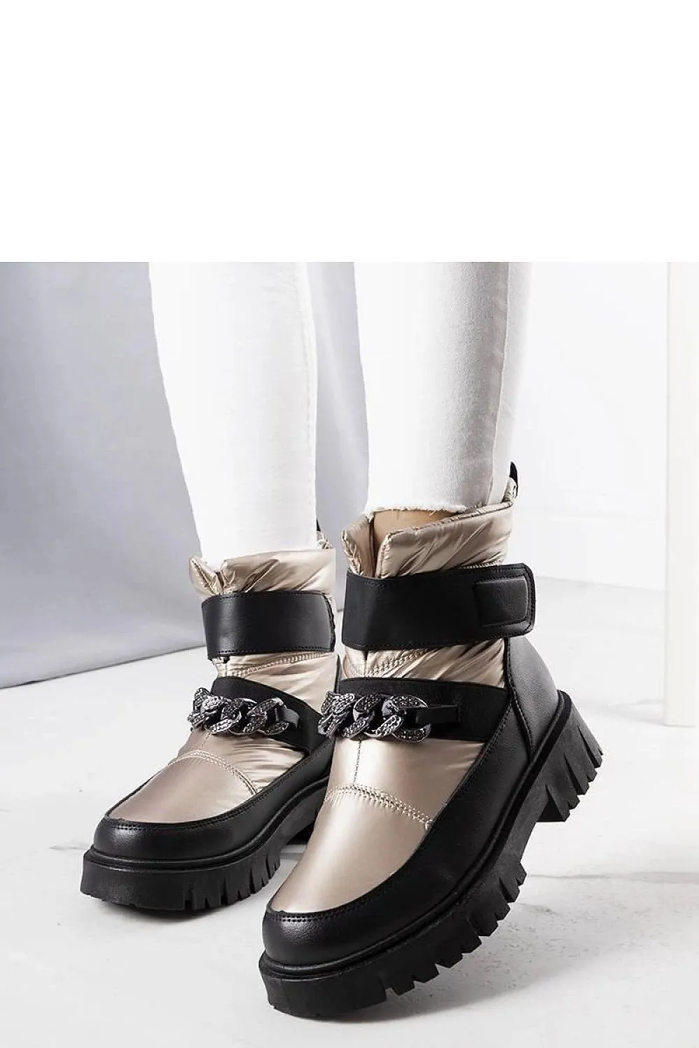 Golden snow boots with a chain